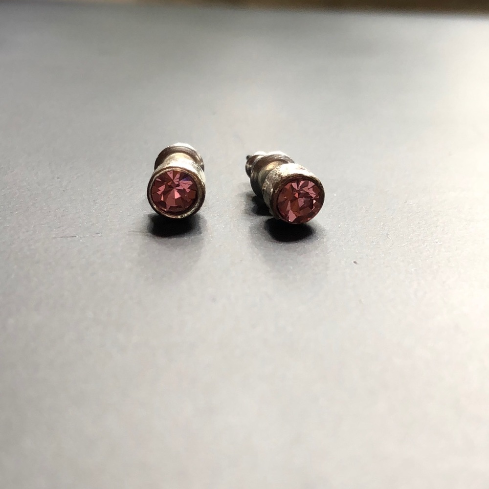 Pink stone stud earrings.